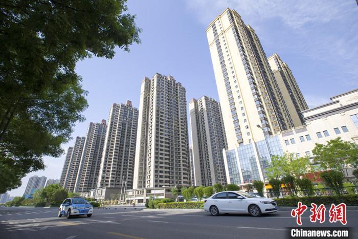 資料圖：車輛從一樓盤前經(jīng)過(guò)。 <a target='_blank' href='/'><p  align=