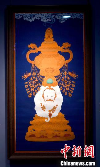 圖為5月16日，展覽中的新創(chuàng)唐卡作品《瑞象承香》?！±盍?攝